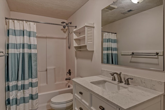 full bathroom with vanity, shower / bath combination with curtain, toilet, and a textured ceiling