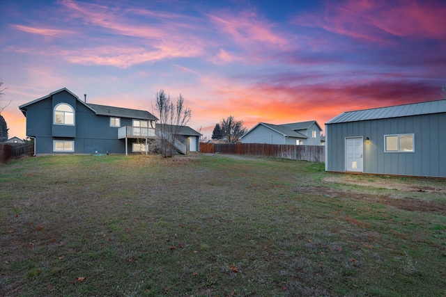 yard at dusk with an outdoor structure