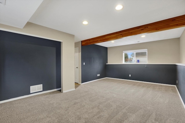 basement featuring light carpet