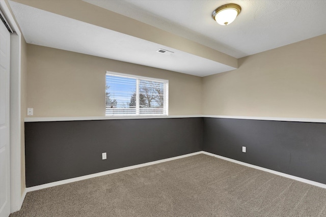 empty room featuring carpet flooring