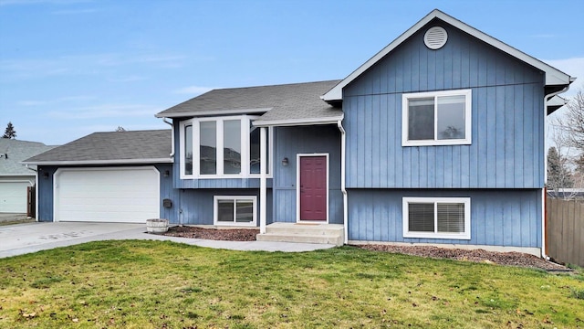 view of front of property featuring a garage and a front lawn