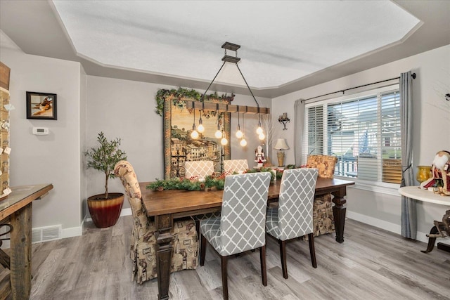 dining area with wood-type flooring