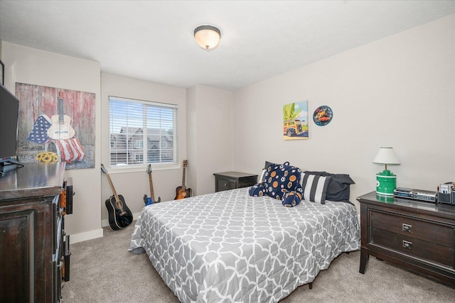 bedroom with light carpet