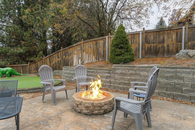 view of patio / terrace featuring an outdoor fire pit