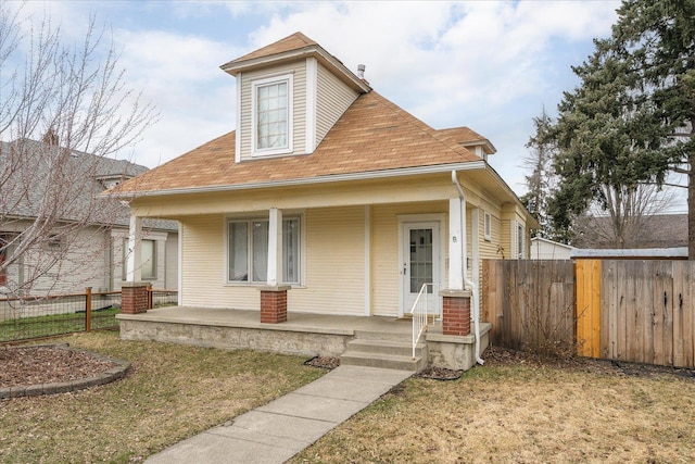 view of front of home featuring a porch and a front lawn