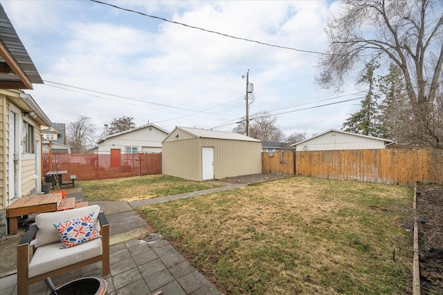 view of yard with a patio area and an outdoor structure