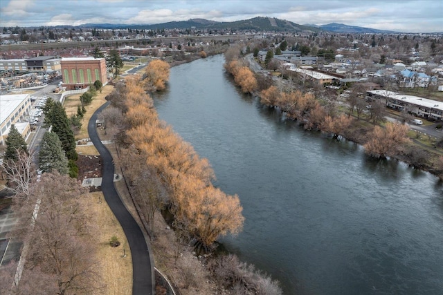 drone / aerial view with a water and mountain view