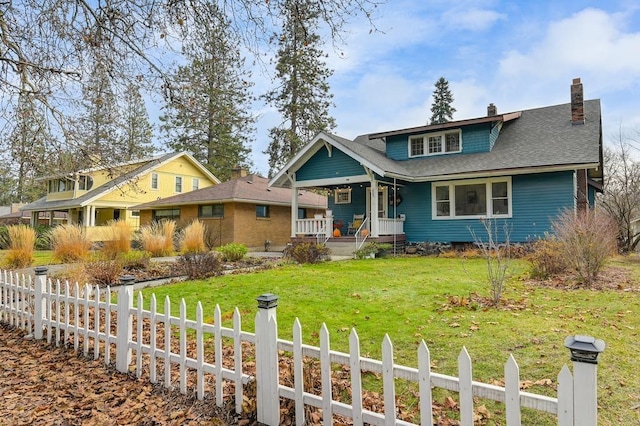 craftsman-style home featuring a front yard and a porch