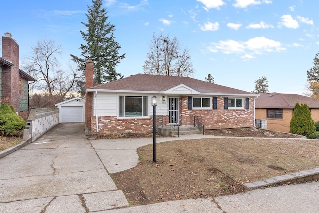 view of front of home featuring an outdoor structure and a garage