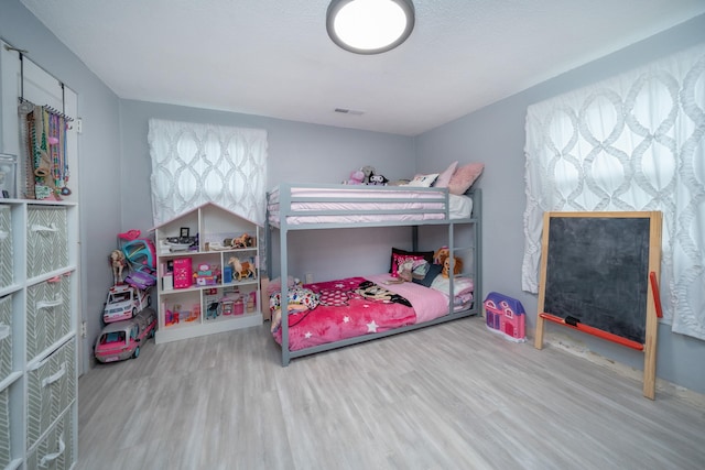 bedroom with wood-type flooring