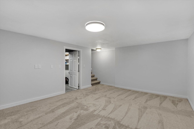 basement featuring light colored carpet