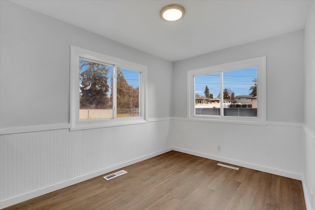 unfurnished room featuring light wood-type flooring