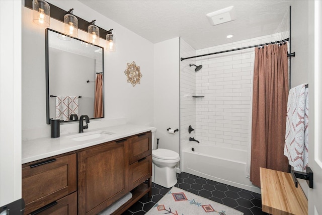 full bathroom featuring tile patterned floors, a textured ceiling, vanity, shower / bathtub combination with curtain, and toilet