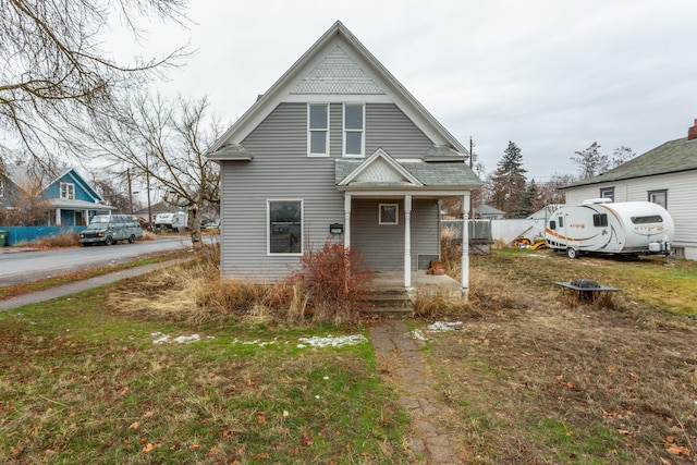 view of front facade with a porch and a front yard