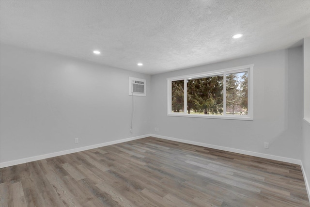 interior space featuring a chandelier, a textured ceiling, and light hardwood / wood-style flooring