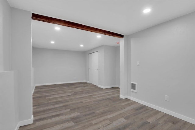 bathroom with hardwood / wood-style floors, vanity, and toilet