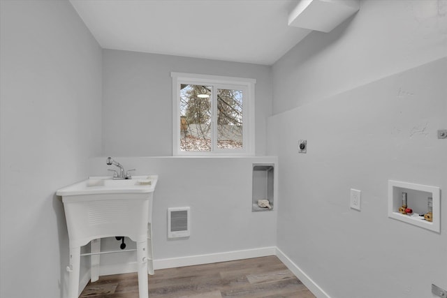 laundry room featuring hookup for an electric dryer, wood-type flooring, and hookup for a washing machine