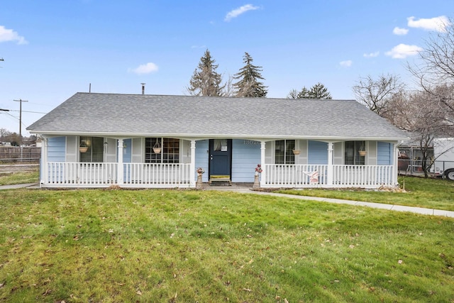 ranch-style home with a front yard and a porch