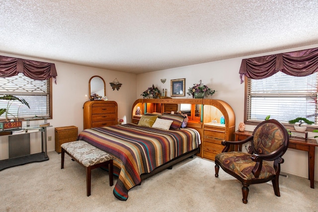 carpeted bedroom with a textured ceiling