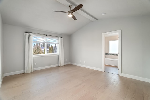 empty room with vaulted ceiling with beams, light hardwood / wood-style flooring, and ceiling fan