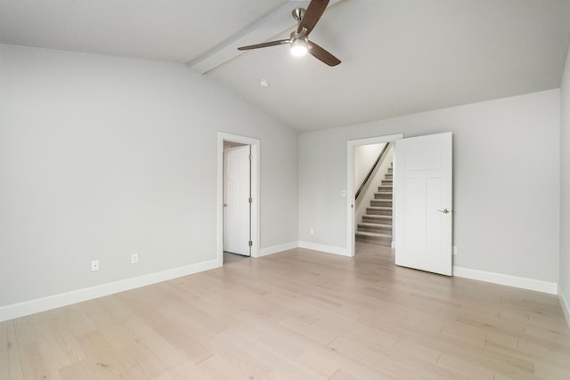 empty room featuring vaulted ceiling with beams, light wood-type flooring, and ceiling fan