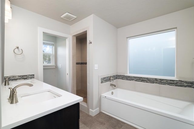 bathroom featuring separate shower and tub and vanity