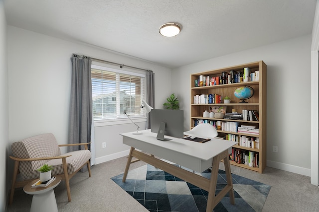 office space featuring carpet and a textured ceiling