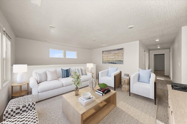 carpeted living room with a textured ceiling