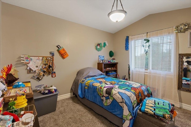 bedroom with lofted ceiling and carpet floors