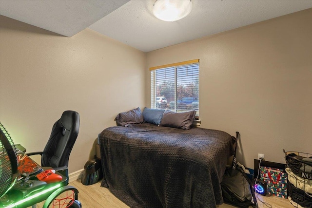 bedroom with light hardwood / wood-style flooring