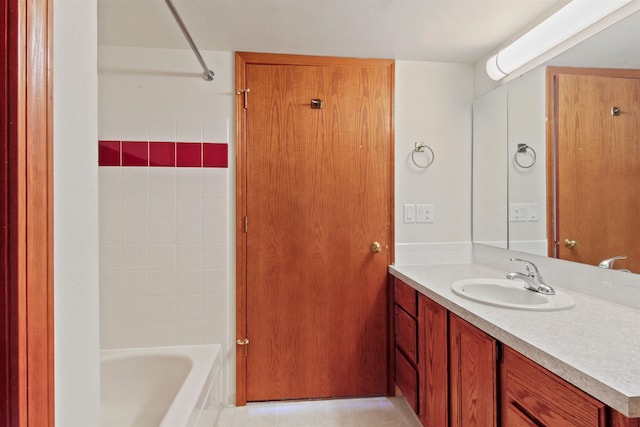 bathroom with vanity and washtub / shower combination