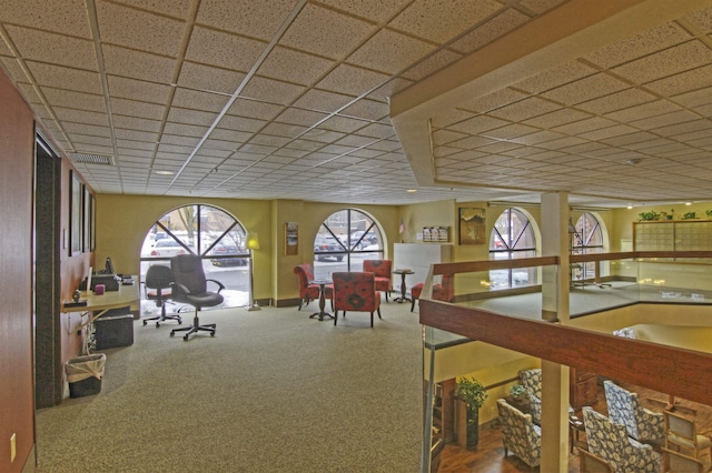 recreation room with carpet flooring and a drop ceiling