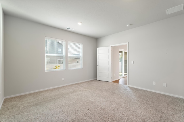 spare room featuring carpet floors