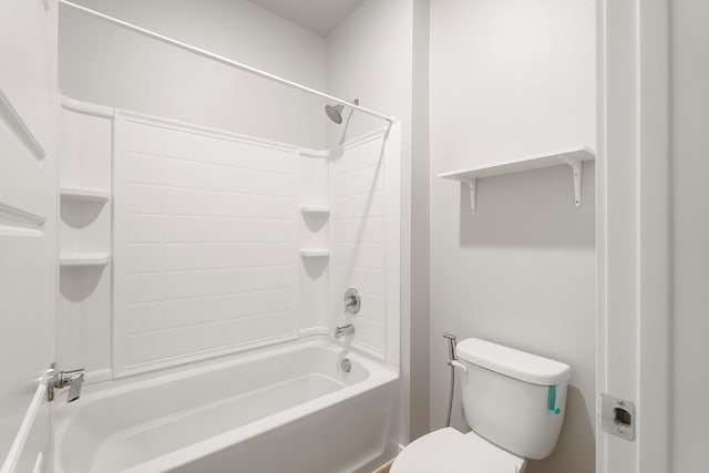 bathroom with bathing tub / shower combination and toilet