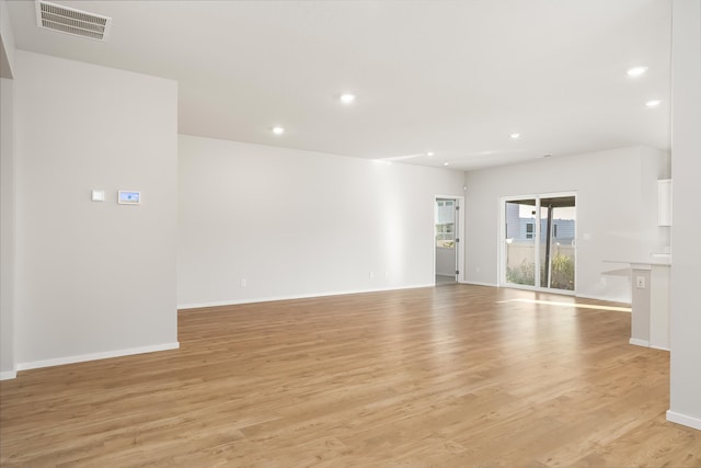 unfurnished living room featuring light hardwood / wood-style floors