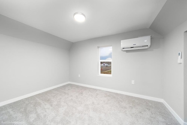 additional living space with carpet flooring, an AC wall unit, and vaulted ceiling