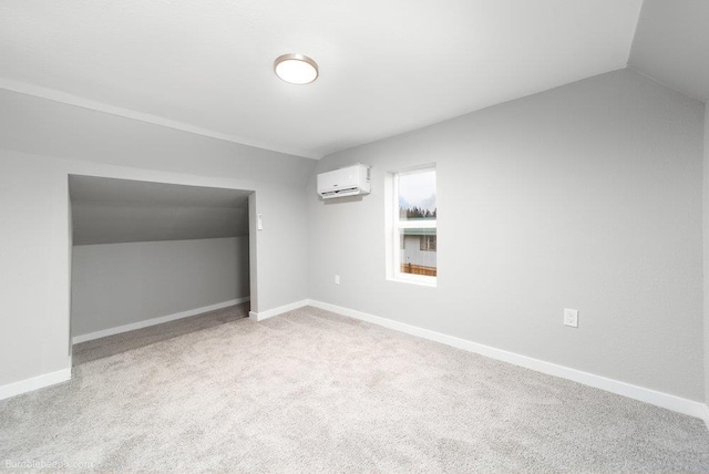 bonus room featuring lofted ceiling, light colored carpet, and a wall mounted air conditioner