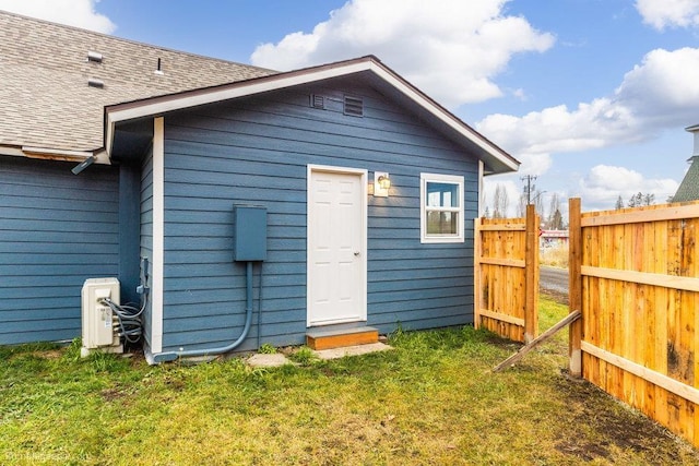 view of outbuilding with a lawn