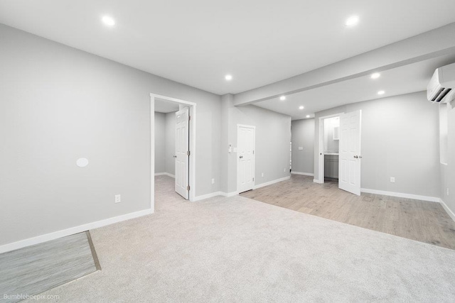 interior space featuring light hardwood / wood-style floors and a wall mounted AC