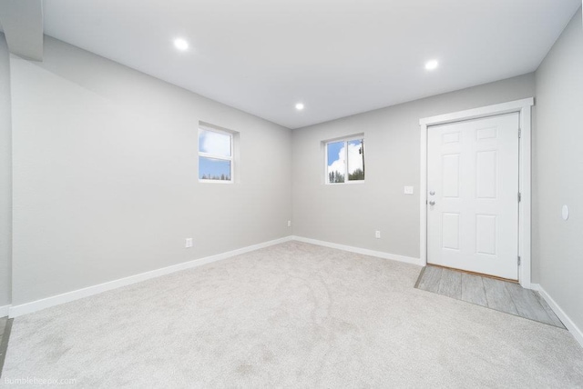 interior space featuring light colored carpet