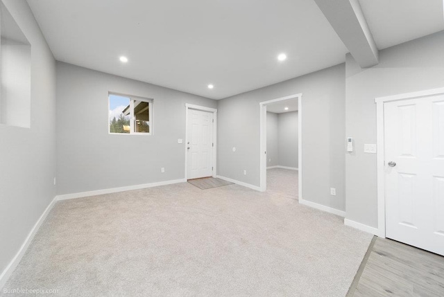 basement with light colored carpet