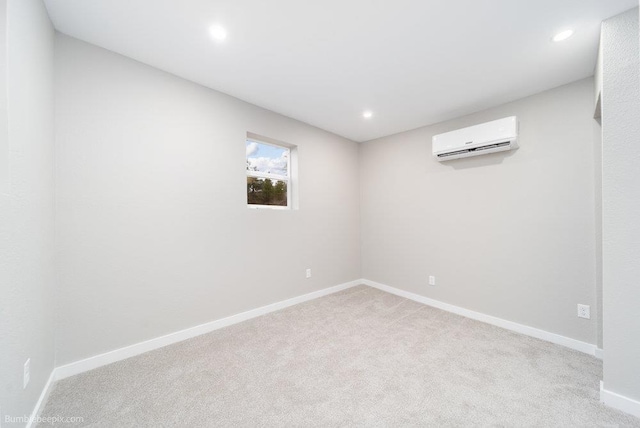 carpeted empty room featuring a wall mounted AC