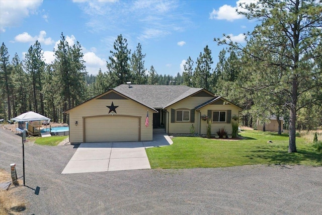 single story home with a front yard and a garage