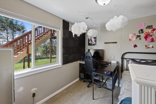 bedroom featuring wood-type flooring