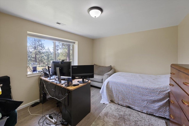 bedroom featuring hardwood / wood-style floors