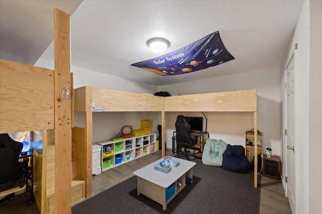 bedroom featuring dark hardwood / wood-style flooring