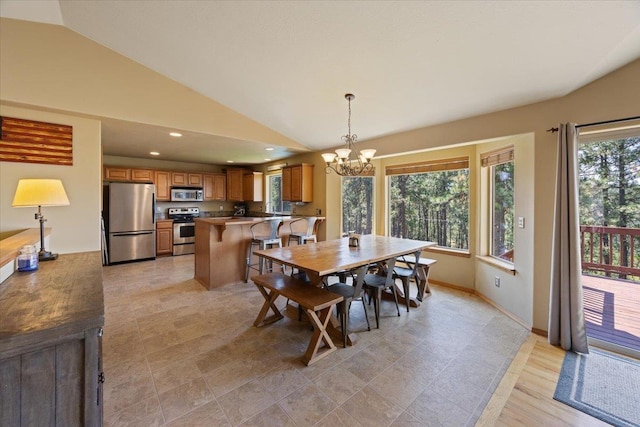 dining space featuring lofted ceiling and a notable chandelier