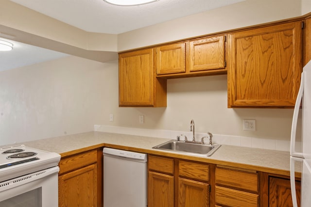 kitchen with sink and white appliances