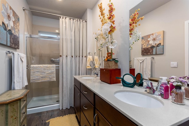 bathroom featuring hardwood / wood-style floors, vanity, and a shower with curtain