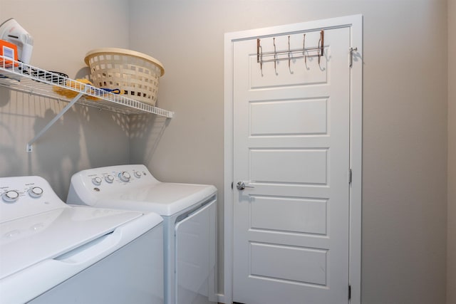 clothes washing area featuring washing machine and dryer